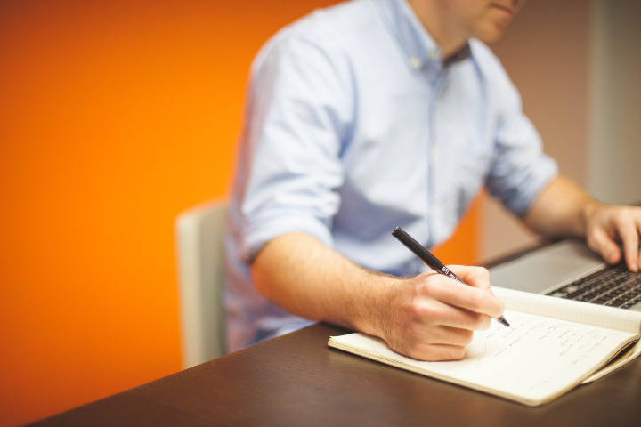 Guy at Desk Writing New York Jobs Startup Stock Photos CC Zero